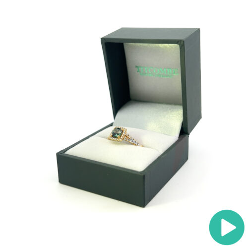 Teal sapphire cushion halo yellow gold ring