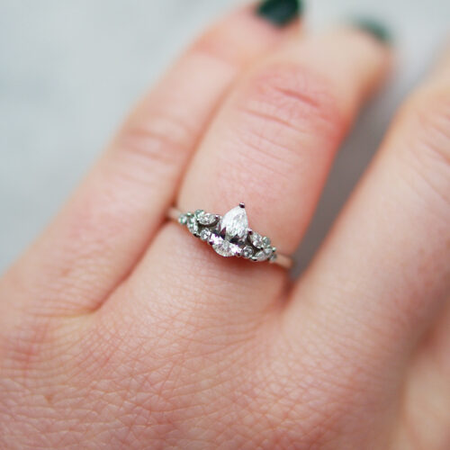 Pear Cut Diamond Engagement Ring in Platinum With Marquise And Round Shoulders