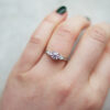 Trilogy Engagement Ring With a Round Brilliant Cut Diamond With Pear Cut Diamond Outers