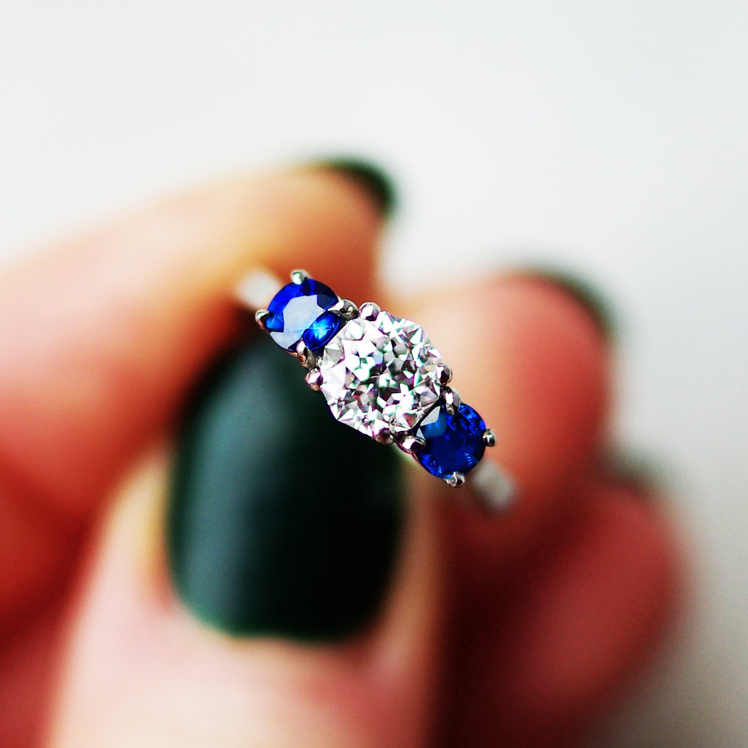 Trilogy Engagement Ring With Two Round Brilliant Cut Sapphires And a Meteor Cut Diamond
