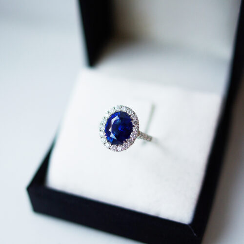 Oval Sapphire Cluster Ring With Diamond Set Shoulders
